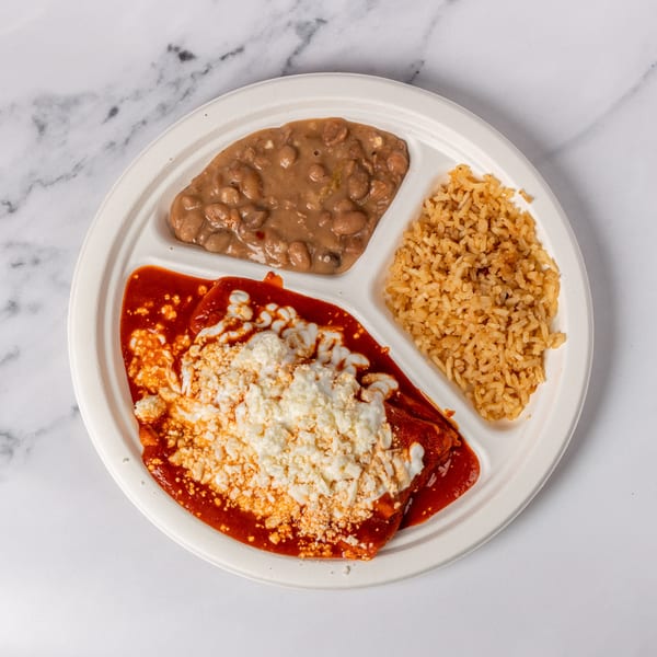 Enchiladas with red sauce and cheese, served with refried beans and rice on a divided plate.
